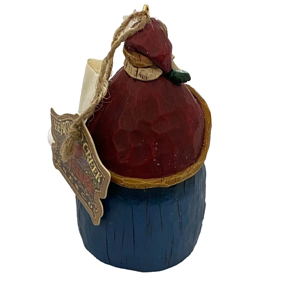 Heartwood Creek Jim Shore Enesco Santa Claus holding a Bell Christmas Ornament